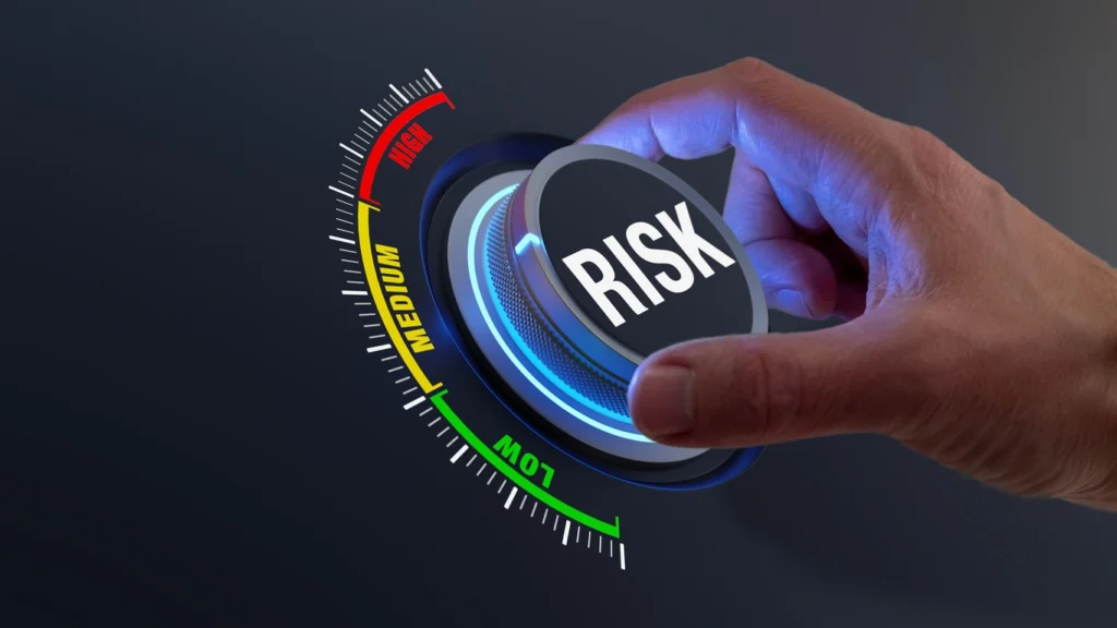 man turning a dial with the word risk in it to signify the use of environmental impact assessment