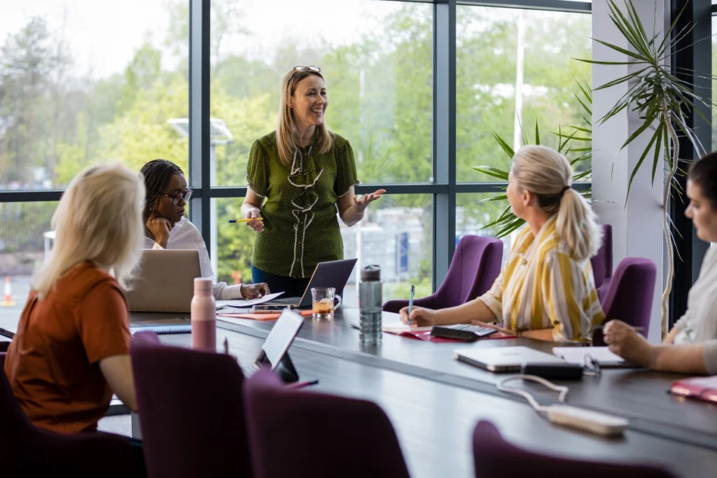 women in a table talking about environmental management pathways