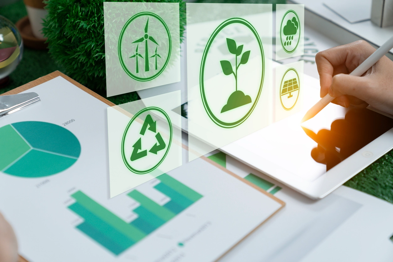 man with a stylus and a tablet with a foreground of environmental resource management icons