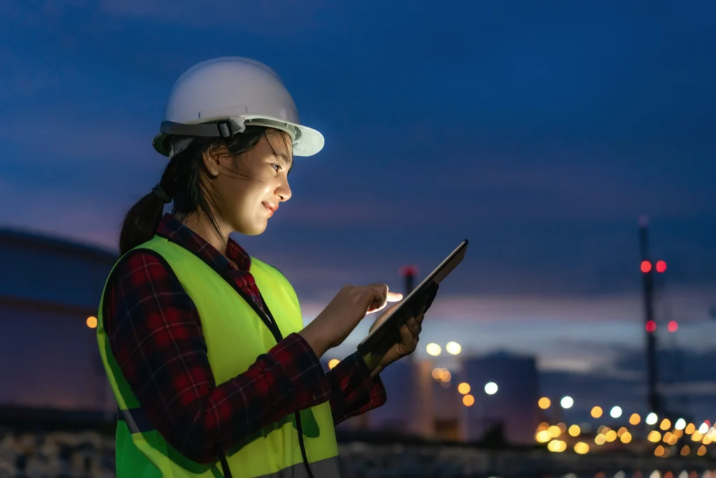 woman performing a biological survey while holding a tablet